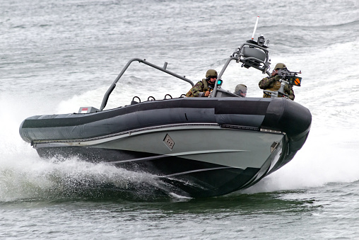 Den Helder, The Netherlands - June 23, 2013: Dutch Marines in a speedboat during an assault demo at the Dutch Navy Days