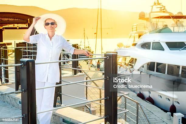 Lady At Boat Dock Stock Photo - Download Image Now - Adult, Adults Only, Boarding