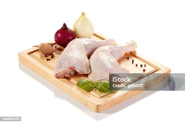 Raw Chicken Legs On Cutting Board Stock Photo - Download Image Now - 2015, Basil, Chicken - Bird