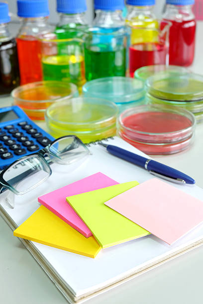 istock calculator and colorful fluid in glassware 466893302