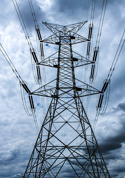istock Electrical transmission wires against cloudy sky 466893840