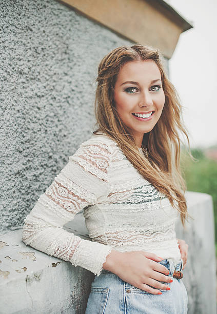 Portrait of a beautiful happy young blonde girl