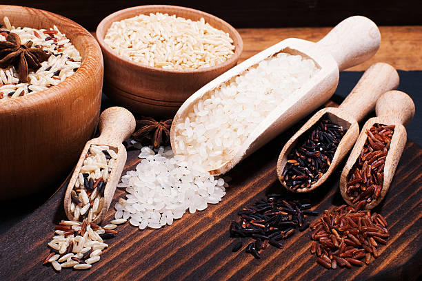 istock Different types of rice on a wooden background 466897346