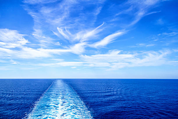 View from stern of big cruise ship Cruise ship wake or trail on ocean surface horizon over water photos stock pictures, royalty-free photos & images