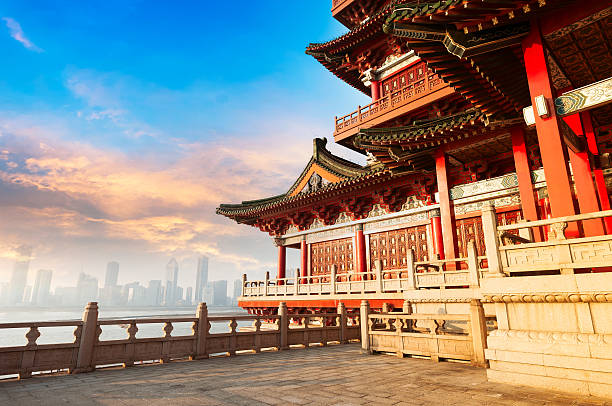 Ancient Chinese architecture with city skyline in background stock photo