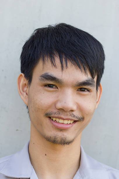 istock asian Young man smiling, portrait 466904201