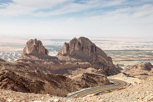 Jebel Hafeet mountains in Al Ain Jebel Hafeet mountains in the outskirts of Al Ain, Emirate of Abu Dhabi, UAE jebel hafeet stock pictures, royalty-free photos & images