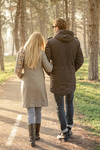 istock Young couple walking in the park 466909081