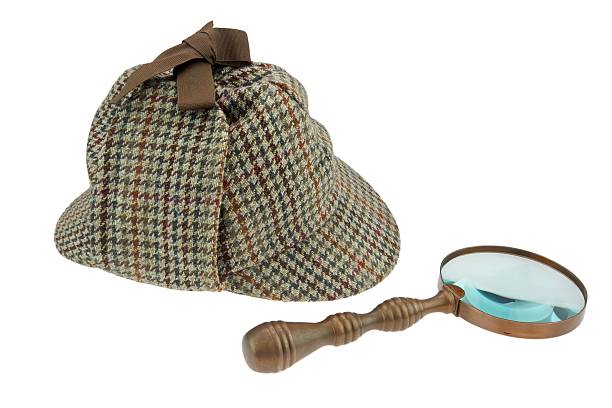 istock Detectives Deerstalker Hat and Retro Magnifying Glass 466911590