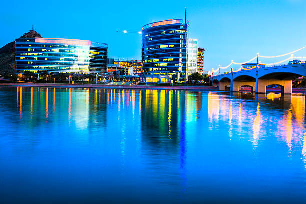 Tempe Arizona and Mill bridge Wide angle view of the Tempe, Arizona skyline view at dusk, with Tempe Town Lake in the foreground. The city of Tempe is a part of the Phoenix Metropolitan Area. Shot with a 5Canon 5D mark 3 tempe arizona stock pictures, royalty-free photos & images