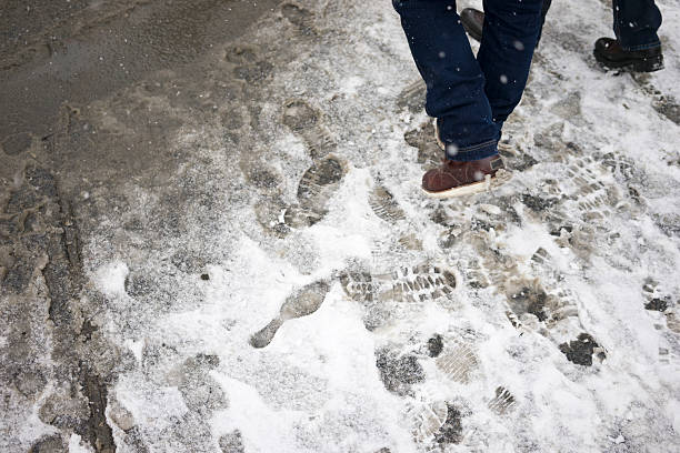 istock Persons walking in the snow 466916069