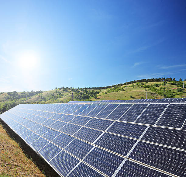 istock Solar photovoltaic cell panels under sunny sky 466918337
