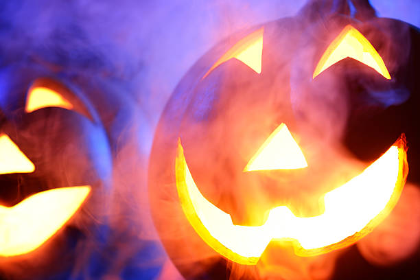 istock Halloween pumpkin in dark blue with spider web and smoke 466918489