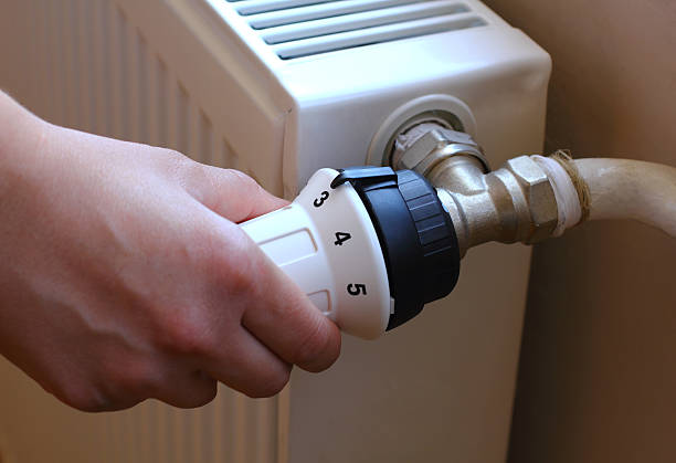 istock Turning on the radiator to save energy 466918781