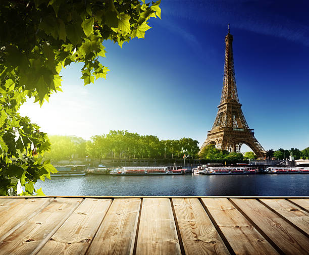 istock background with wooden deck table and  Eiffel tower in Paris 466921450