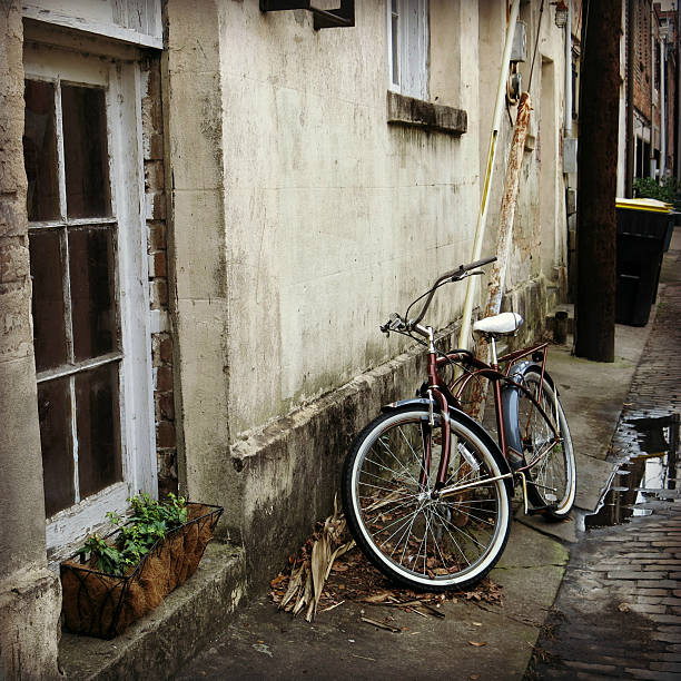 istock Old Bicycle in Savannah, Georgia Alley next to Window Box 466921928