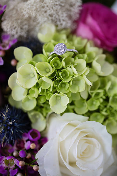 Engagement ring on a beuatiful bouquet. stock photo