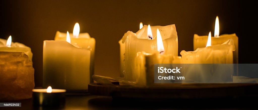 White Candles Creating a Romantic Atmosphere Panoramic shot of candles. 2015 Stock Photo