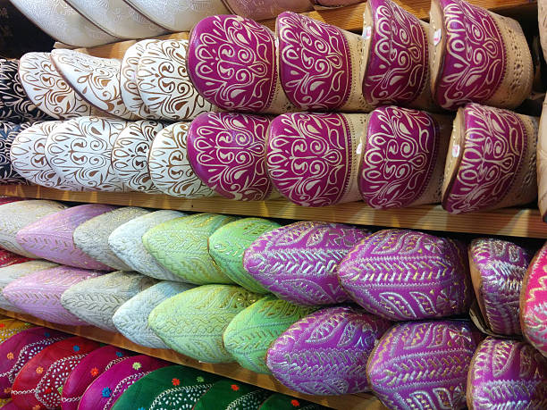 Shoes of all colors lined up and organized at a market in Morroco.