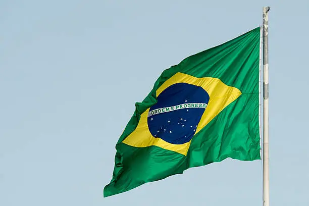 Brazilian Flag in a blue sky background
