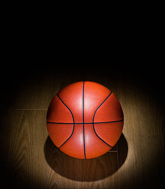istock Spotlighted Basketball lonely on a Gym Floor 466931127