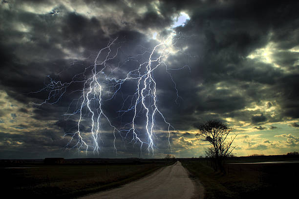 istock Asphalt road and dark stormy clouds over it 466931869
