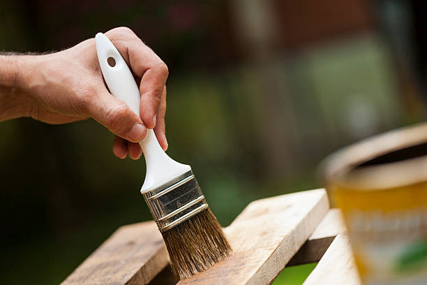 istock Man painting a wooden deck 466932817