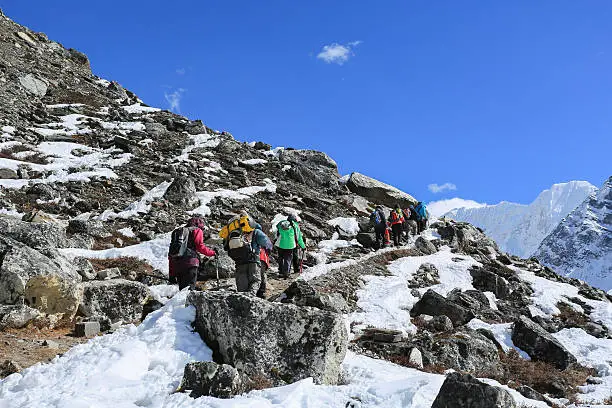 trekker on glacier beside of everest basecamp from everest trek nepal
