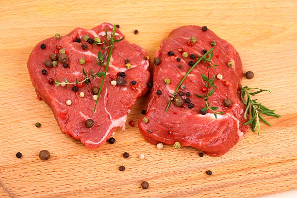 istock Two juicy beef steak with spices and herbs 466936255