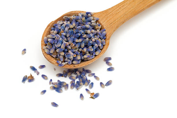 istock lavender petals in a wooden spoon 466936625