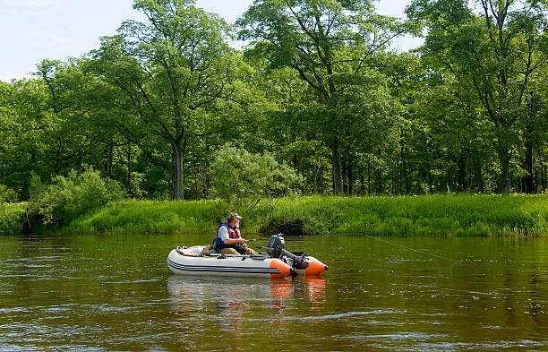 istock Fisherman in boat fishing 466938141