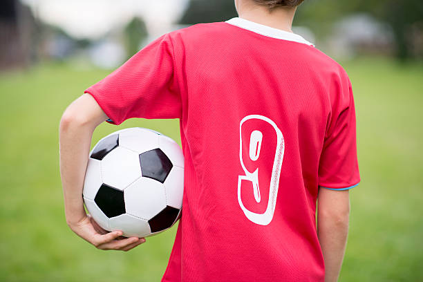 istock Holding Soccer Ball 466938578