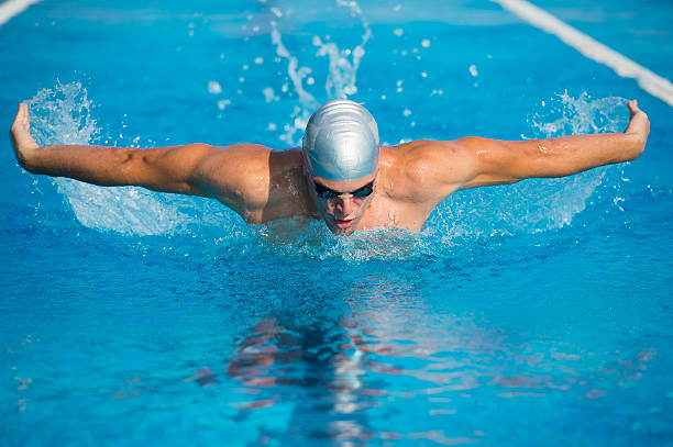 istock Young male professional swimmer at butterfly stroke 466943993