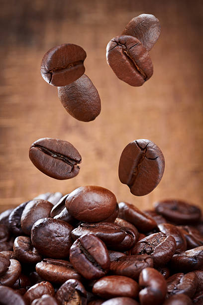 istock Closeup of falling coffee beans 466944204