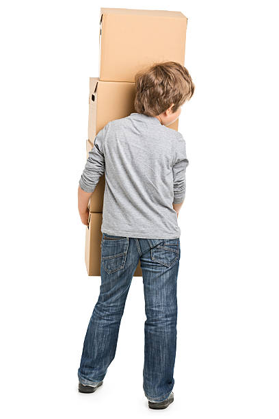 istock portrait of small boy with boxes 466947761