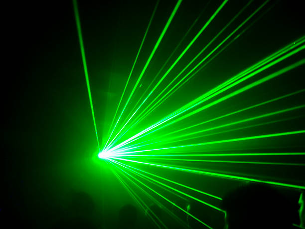 Artistic depiction of a laser attack on an aircraft during an approach at night. Due to a potential blinding of pilots laser attacks pose a serious threat to aviation safety and pilot health.
