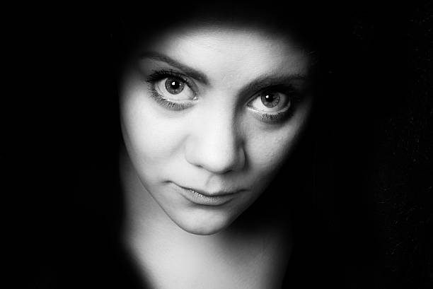 istock bigeye shy young woman 466950492