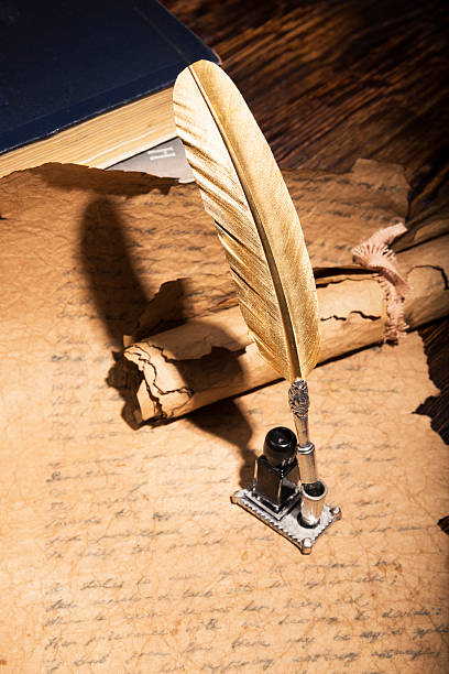 istock Vintage golden pen and ancient manuscripts 466951396