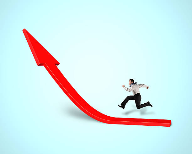 istock Businessman running on growing red arrow 466951973