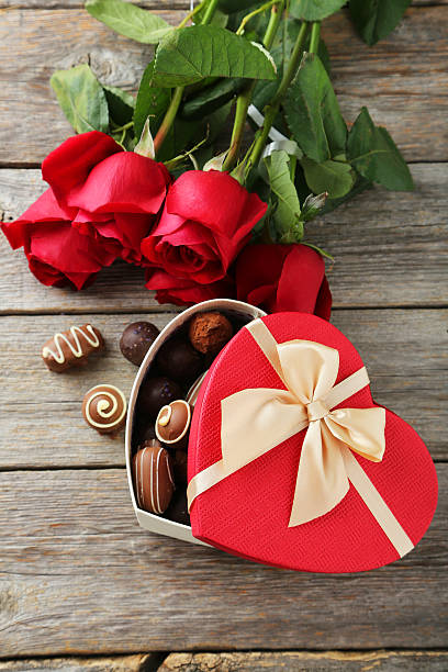 istock Beautiful heart gift box with chocolates on grey wooden backgrou 466952670