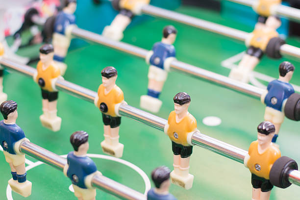 istock Foosball table or soccer and players 466952698