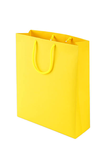 istock Yellow shopping bag isolated on white 466952844