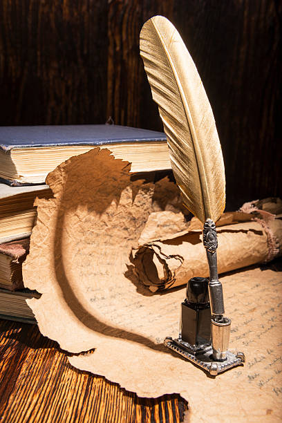 istock Vintage golden pen and ancient manuscripts 466953420