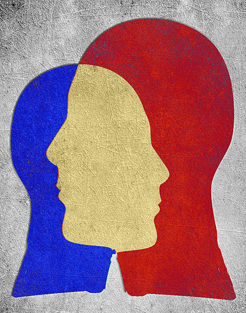 istock two colored head slihouette  psychology concept 466953720