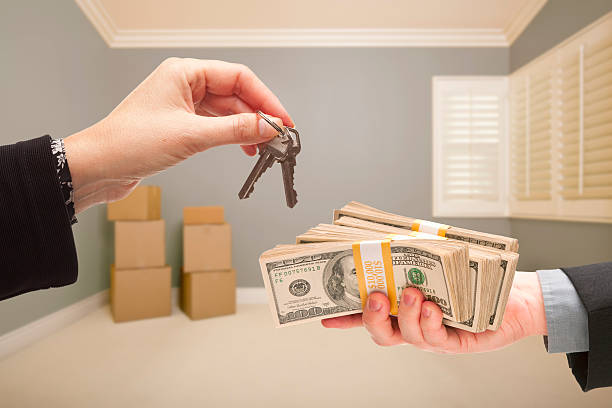 istock Handing Over Cash For House Keys 466955455