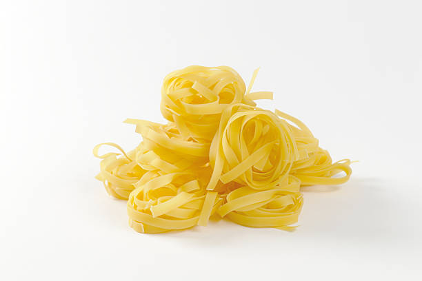 istock Nests of dry pasta tagliatelle 466956298