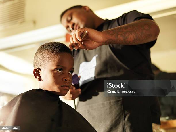 Photo Of A Boy Getting His Hair Cut By A Barber Stock Photo - Download  Image Now - Barber Shop, Barber, African-American Ethnicity - iStock