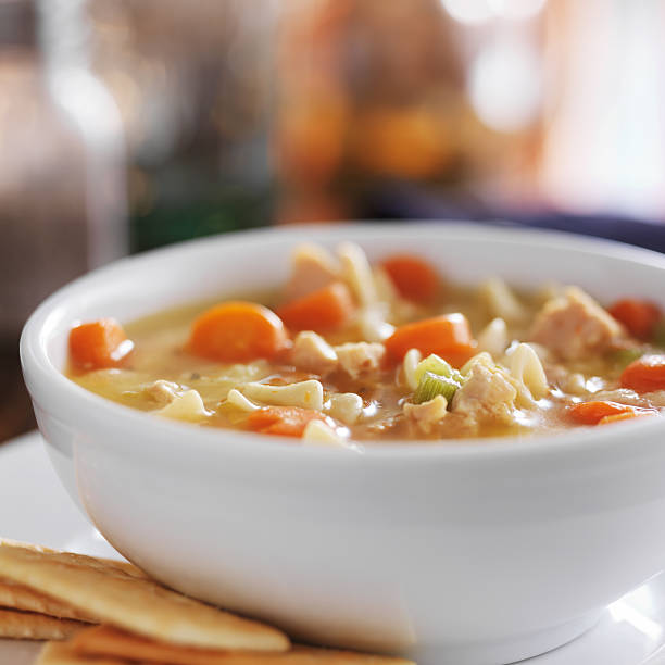 istock chicken noodle soup with crackers close up 466956476