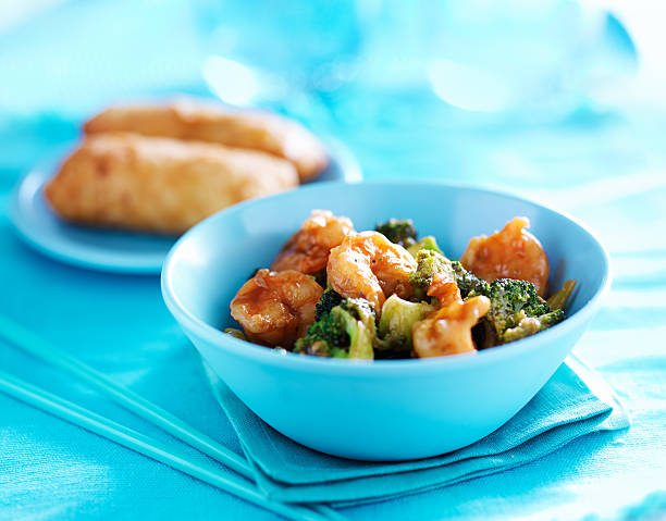 chinese shrimp stir fry in colorful table setting