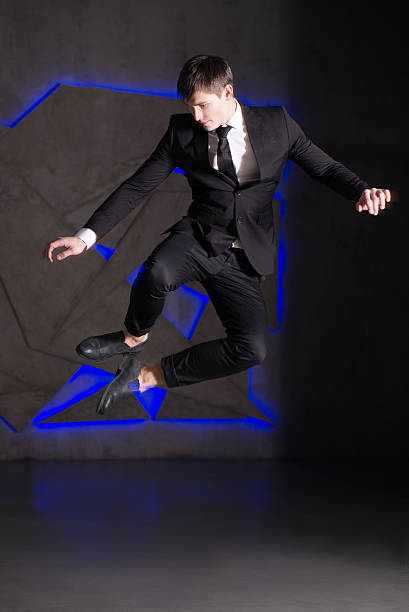istock Succesful business man in suit. Studio. Jump. Successful 466956924